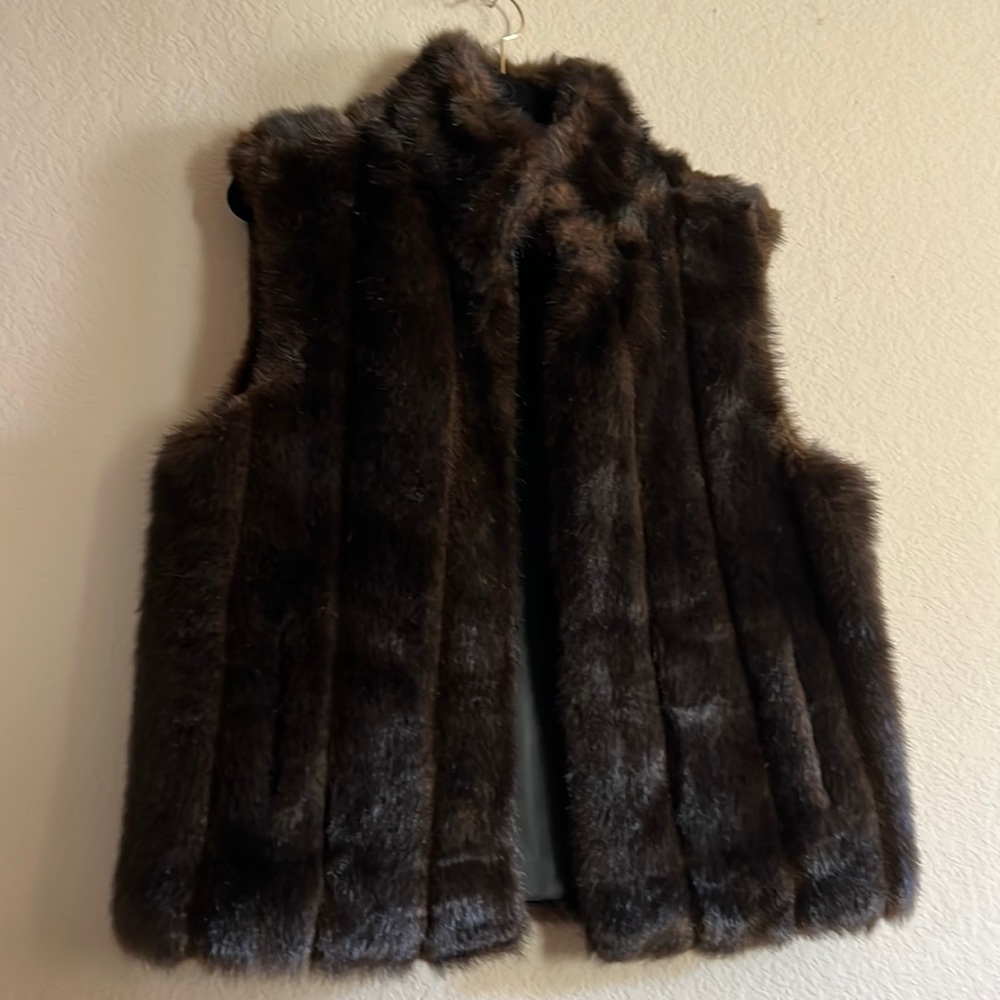 This decadent faux fur is reversible. With pockets